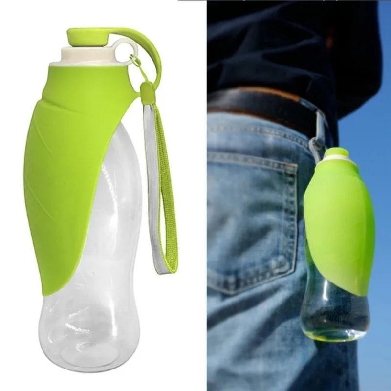 FurMidables green portable 580ml pet water bottle with silicone bowl, clipped to a belt for outdoor travel.