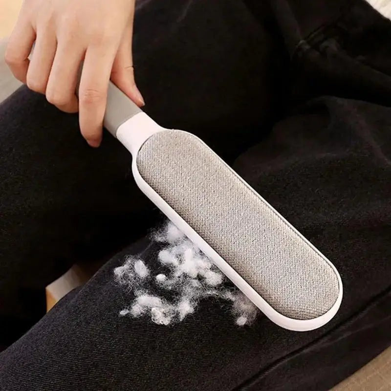 FurMidables double-sided electrostatic pet hair remover brush cleaning lint from black jeans