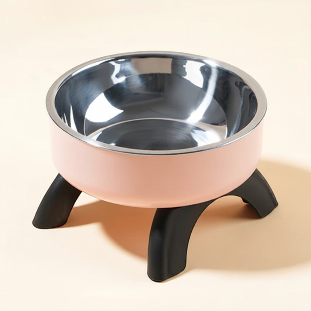 FurMidables elevated pet bowl with a light pink plastic base, black legs, and a removable stainless steel insert.
