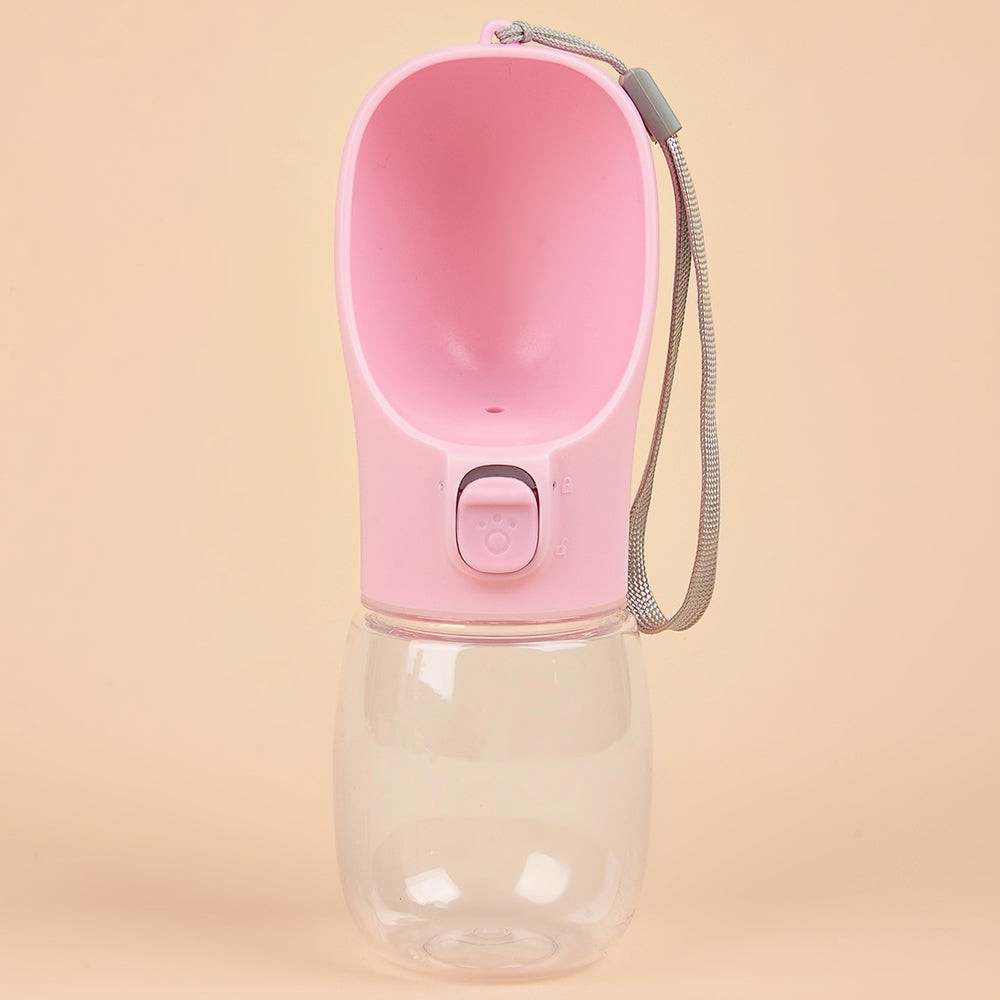 FurMidables pink portable pet water bottle with a built-in drinking trough and carry lanyard for travel